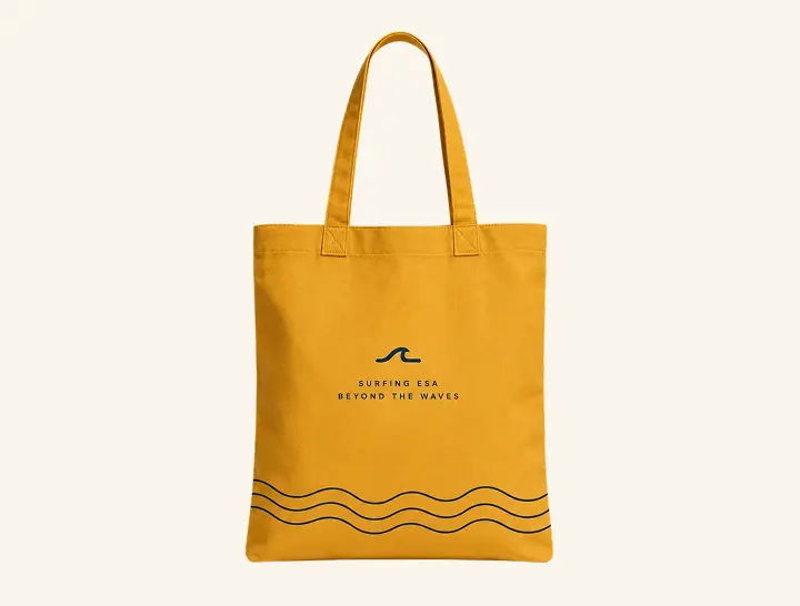 Surfing ESA yellow tote bag with wave lines