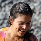 Maria Elena Pacas with her surfboard
